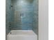 Shower features blue subway tile with bronze fixtures and a built in niche at 9005 Stern Aly, Johns Island, SC 29455