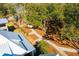 Aerial view showcases the roof and wooded backyard at 9009 Stern Aly, Johns Island, SC 29455