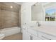 Cozy bathroom featuring a vanity with light countertops and a shower-tub combo with tile surround at 9009 Stern Aly, Johns Island, SC 29455