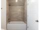 Well-lit bathroom showcases a bathtub with tile surround and a built-in shower head at 9009 Stern Aly, Johns Island, SC 29455