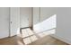 Bright bedroom featuring hardwood floors, white walls, and natural light streaming through the windows at 9009 Stern Aly, Johns Island, SC 29455