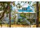 Beautiful exterior view of home with white siding and trees at 9009 Stern Aly, Johns Island, SC 29455