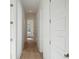 Hallway with wood floors, white walls and trim, leading to a glass door at the end at 9009 Stern Aly, Johns Island, SC 29455