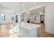 Open floor plan shows kitchen island and living area with a fireplace at 9009 Stern Aly, Johns Island, SC 29455
