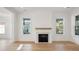 Living room featuring a fireplace and lots of windows at 9009 Stern Aly, Johns Island, SC 29455