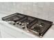 Close-up of stainless steel stovetop with gas burners at 9009 Stern Aly, Johns Island, SC 29455