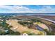 Aerial view of golf course with marsh and bridge in background at 11 Perry St, Charleston, SC 29403