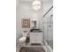 Bathroom with white vanity, walk-in shower, and geometric tile at 11 Perry St, Charleston, SC 29403