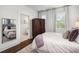 Bright bedroom with hardwood floors and en-suite bathroom at 11 Perry St, Charleston, SC 29403