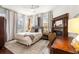 Charming bedroom with hardwood floors, fireplace, and window seating at 11 Perry St, Charleston, SC 29403