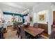 Modern dining room features a long wooden table and stylish lighting at 11 Perry St, Charleston, SC 29403