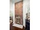 Rustic brick fireplace with a modern white mantel at 11 Perry St, Charleston, SC 29403