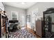 Home office with built-in shelving and hardwood floors at 11 Perry St, Charleston, SC 29403