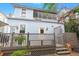Charming light blue house with a large deck and fenced yard at 11 Perry St, Charleston, SC 29403