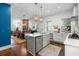 Renovated kitchen with white cabinets, marble countertops, and stainless steel appliances at 11 Perry St, Charleston, SC 29403