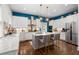 Modern kitchen with white cabinets, marble counters, and stainless steel appliances at 11 Perry St, Charleston, SC 29403