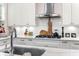White kitchen with stainless steel appliances and geometric backsplash at 11 Perry St, Charleston, SC 29403