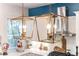 Gold geometric light fixtures illuminate the kitchen at 11 Perry St, Charleston, SC 29403