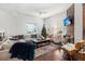 Bright living room featuring a comfortable sectional sofa and hardwood floors at 11 Perry St, Charleston, SC 29403