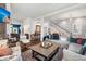 Open living room with hardwood floors and view of the staircase at 11 Perry St, Charleston, SC 29403