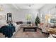 Cozy living room with sectional sofa, coffee table, and Christmas tree at 11 Perry St, Charleston, SC 29403