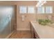 Bathroom with double vanity, frosted glass shower, and tile floors at 1374 Leisure Dr, Summerville, SC 29486