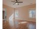 Sunlit bedroom featuring hardwood floors and two windows at 1374 Leisure Dr, Summerville, SC 29486