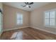 Spacious bedroom with hardwood floors and two windows at 1374 Leisure Dr, Summerville, SC 29486