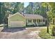 Charming one-story house with a white garage door and landscaped yard at 1374 Leisure Dr, Summerville, SC 29486