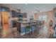 Modern kitchen with a large island, stainless steel appliances and hardwood floors at 1374 Leisure Dr, Summerville, SC 29486