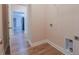 Laundry room with wood floors and access to the kitchen at 1374 Leisure Dr, Summerville, SC 29486