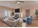 Living room with fireplace, hardwood floors and plenty of natural light at 1374 Leisure Dr, Summerville, SC 29486