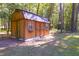 Wooden storage shed nestled in the trees at 1374 Leisure Dr, Summerville, SC 29486