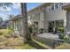 Private back patio with spacious sunroom, lush landscaping, and tree-lined yard at 14 Wappoo Creek Pl, Charleston, SC 29412