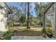 Landscaped backyard with mature trees, offering a peaceful retreat at 14 Wappoo Creek Pl, Charleston, SC 29412