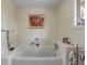 Clean bathroom with white tub and decorative artwork at 14 Wappoo Creek Pl, Charleston, SC 29412