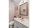 Small bathroom with white vanity, toilet and ornate mirror at 14 Wappoo Creek Pl, Charleston, SC 29412