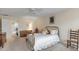 Bright bedroom with brass bed, dresser and access to another room at 14 Wappoo Creek Pl, Charleston, SC 29412
