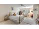 Cozy bedroom with brass bed frame, dresser, and window seat at 14 Wappoo Creek Pl, Charleston, SC 29412