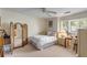 Bedroom with a full-size bed, a desk, and a window with blinds at 14 Wappoo Creek Pl, Charleston, SC 29412