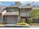 Attractive 2-story townhome with gray siding, a double garage, and landscaping at 14 Wappoo Creek Pl, Charleston, SC 29412