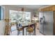 Bright kitchen with breakfast area and view of sunroom at 14 Wappoo Creek Pl, Charleston, SC 29412