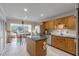 Well-equipped kitchen with oak cabinets, island, and stainless steel appliances at 14 Wappoo Creek Pl, Charleston, SC 29412