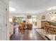 Open floor plan with hardwood floors, dining area, and living room at 14 Wappoo Creek Pl, Charleston, SC 29412