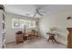 Home office features a desk, chair, built-in shelving, and window at 14 Wappoo Creek Pl, Charleston, SC 29412