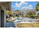 Relaxing pool area with lounge chairs and tables, perfect for entertaining at 14 Wappoo Creek Pl, Charleston, SC 29412
