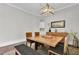 Elegant dining room with hardwood floors, a wood table, and bench seating at 1615 Paradise Lake Dr, Mount Pleasant, SC 29464