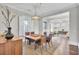 Open concept dining room with a large table, hardwood floors and view of living area at 1615 Paradise Lake Dr, Mount Pleasant, SC 29464
