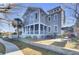 Gray house with a patio, screened porch, and backyard at 1615 Paradise Lake Dr, Mount Pleasant, SC 29464
