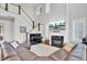 Gathering room with hardwood floors, fireplace, large sectional sofa and stairs at 1615 Paradise Lake Dr, Mount Pleasant, SC 29464